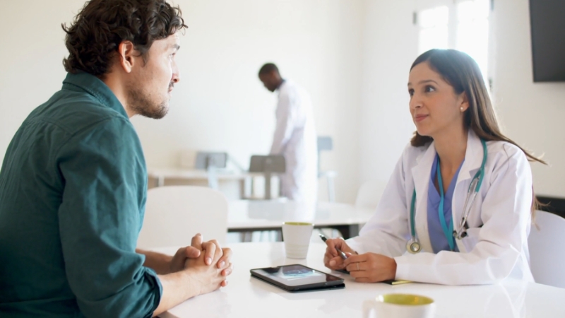 Provider meeting with a staff member to review details after PECOS enrollment approval