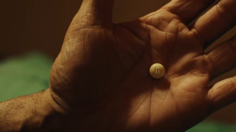A hand holds a small weight loss pill, reflecting patient impact after the Hims & Hers Wegovy withdrawal