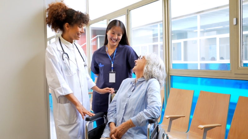 Nurse and doctor talking with a patient about care