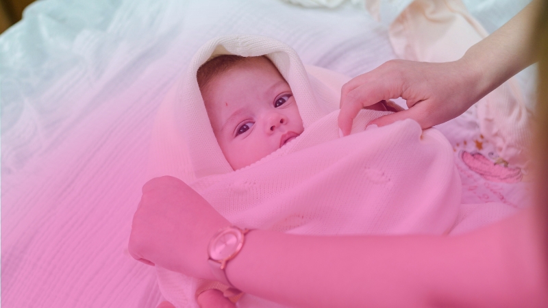 Newborn baby in hospital bed representing a Code Pink infant security alert