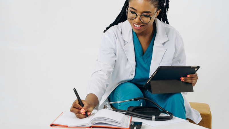 Nursing graduate reviewing notes and preparing to register for the NCLEX-RN exam