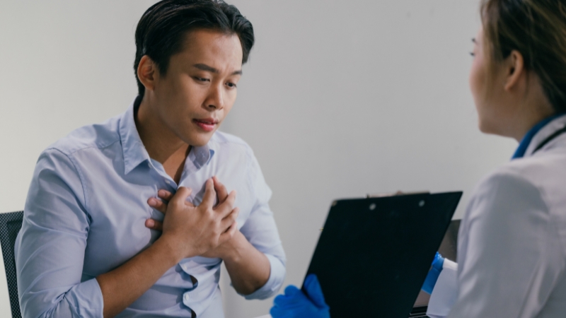 Immigrant patient speaking with a doctor during a medical visit
