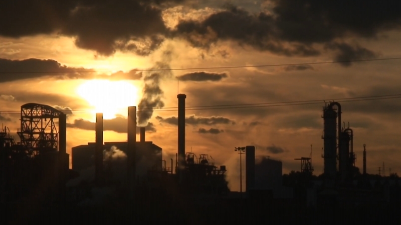 Industrial plant smokestacks release pollution associated with chemical exposure risks to brain development