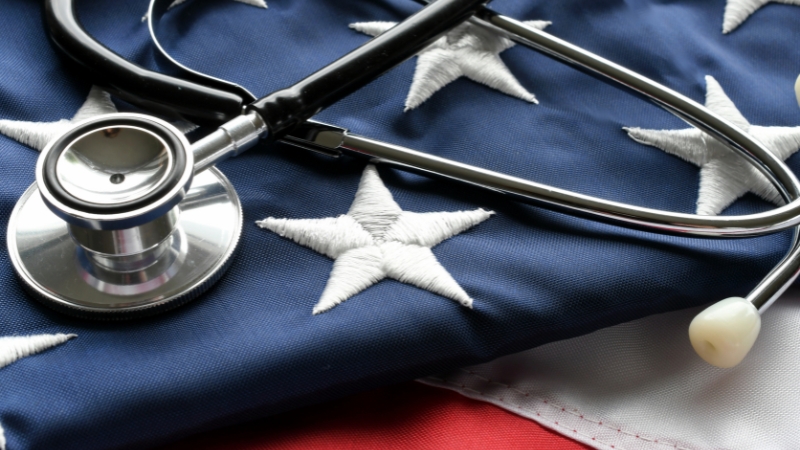Stethoscope resting on an American flag to represent Medicaid and CHIP coverage