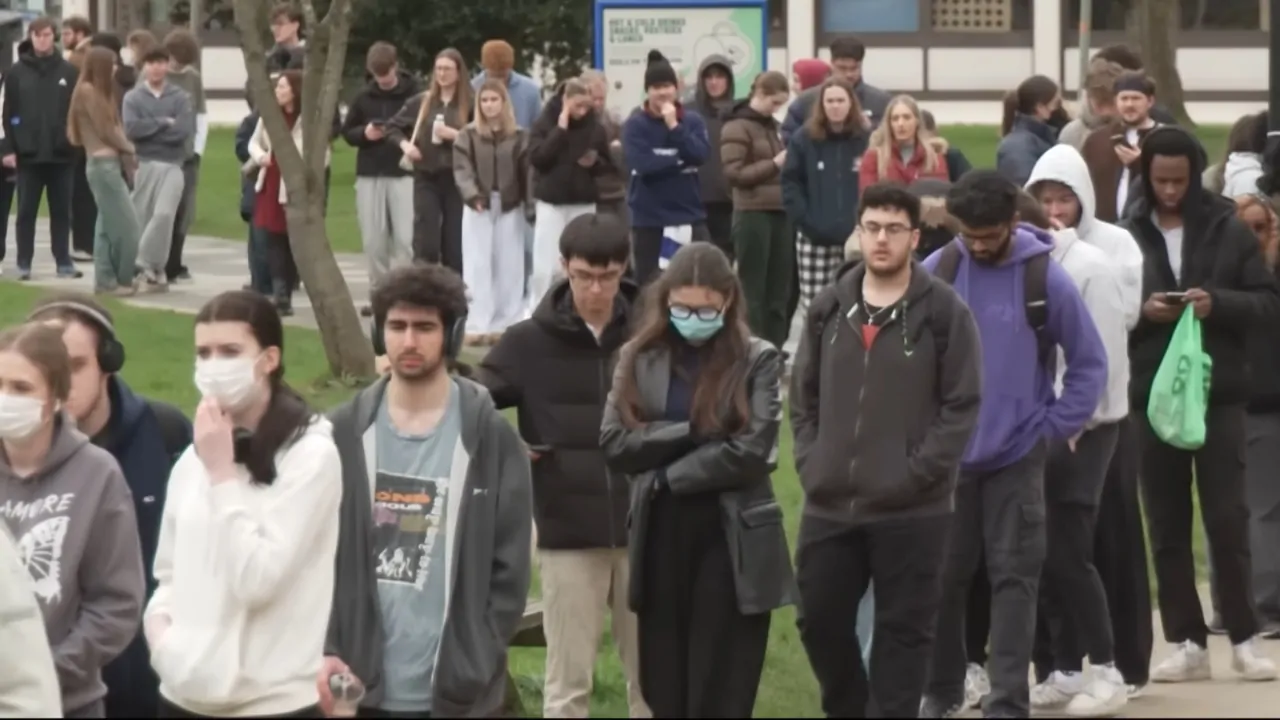 Students line up on campus during meningitis panic in Kent