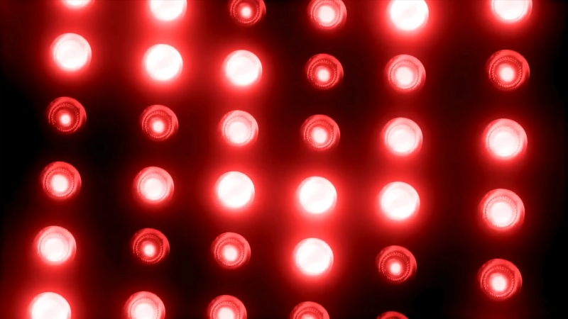 Close-up of a near infrared light therapy panel with multiple illuminated LEDs