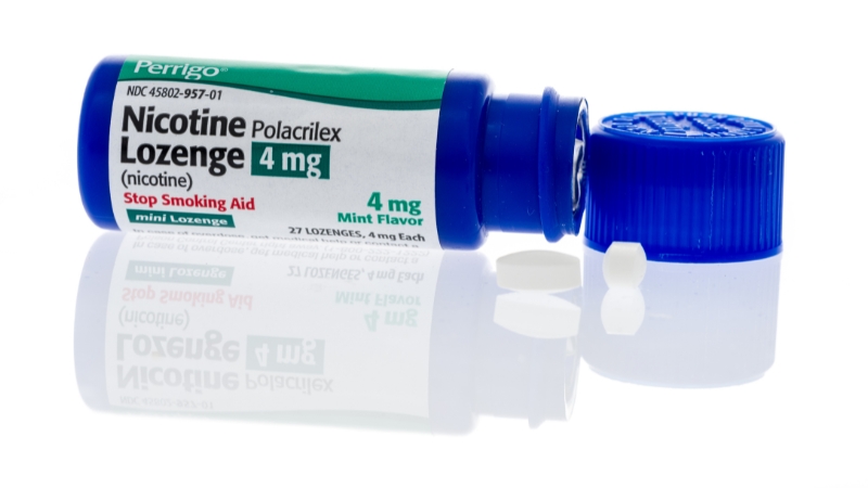 Bottle of nicotine lozenges used as a smoking cessation aid to reduce cravings