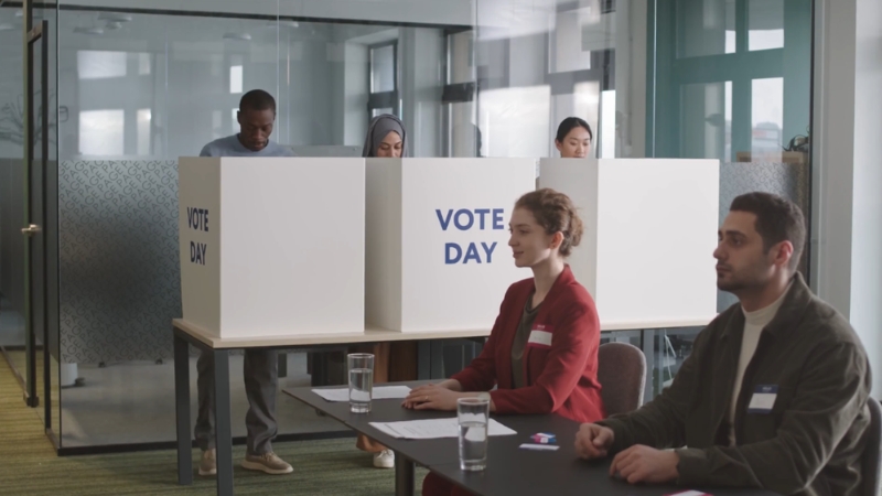 Voters cast ballots in private booths during a U.S. election at a polling station
