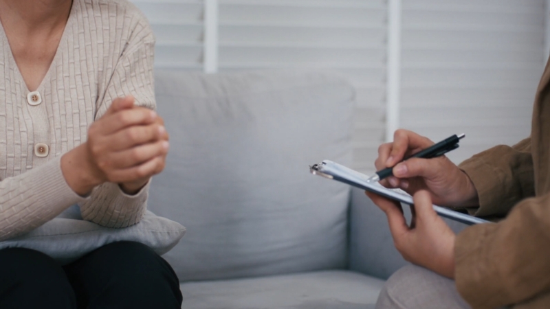 Patient speaking with a therapist about mental health services during a counseling session