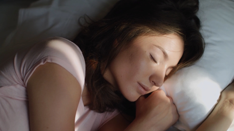 Woman sleeping peacefully to support natural hormone balance