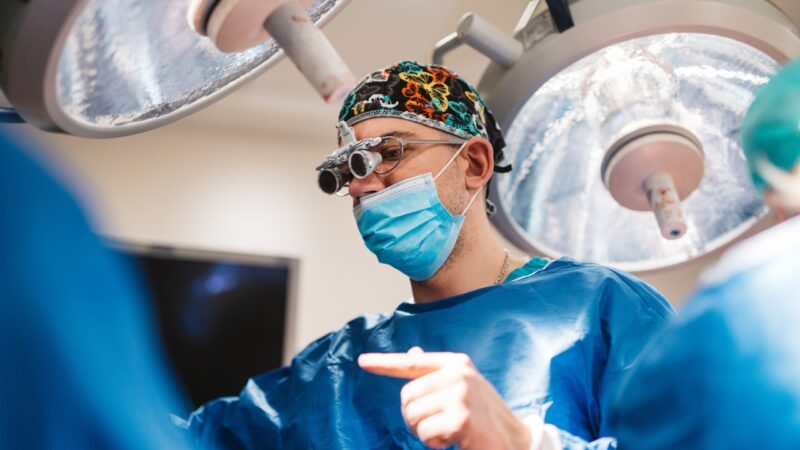 Surgeon performs a procedure in a private clinic setting in Saskatchewan