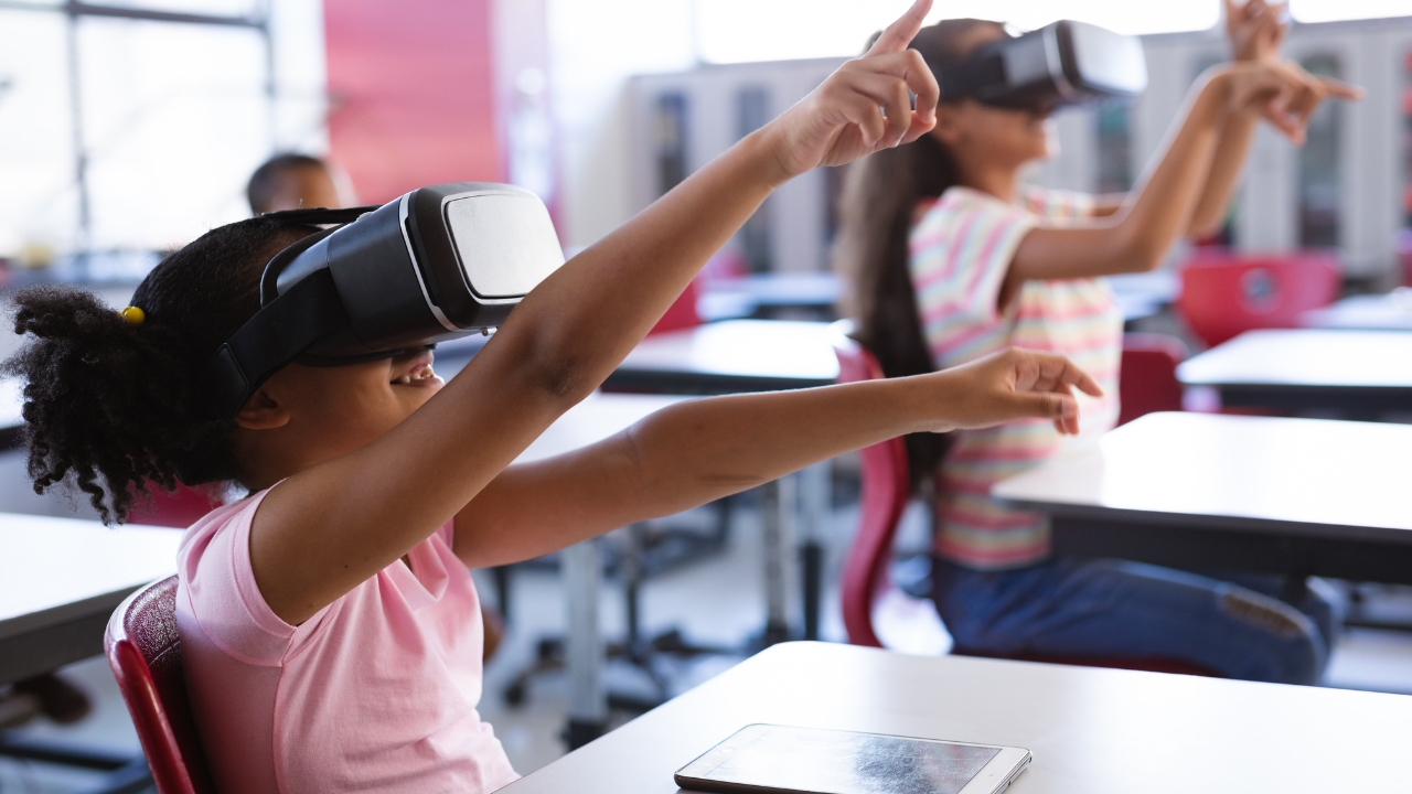 Students use virtual reality headsets during a classroom technology lesson