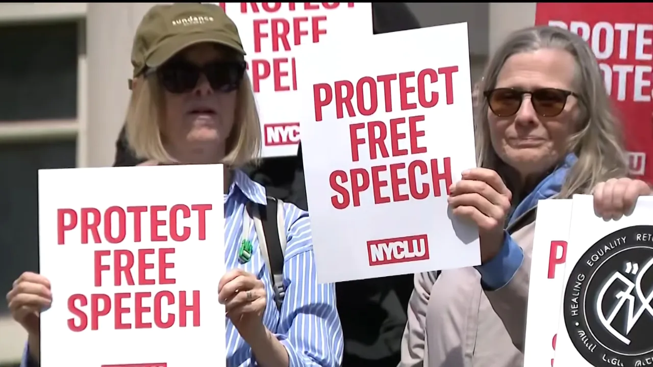 Protesters in New York hold signs calling to protect free speech