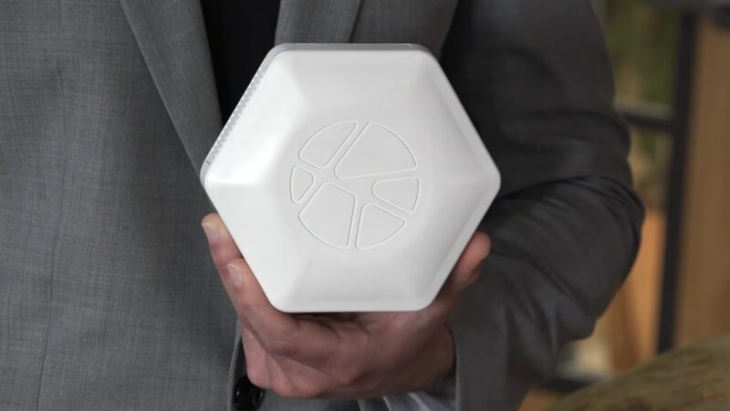 Person holding a PAUL sensor used for senior fall risk monitoring