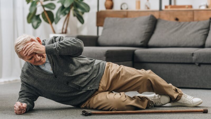 Older man lying on the floor after a fall at home