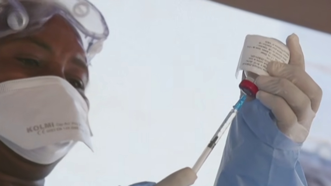 Ebola response guidance appears on a mobile screen during outbreak coverage