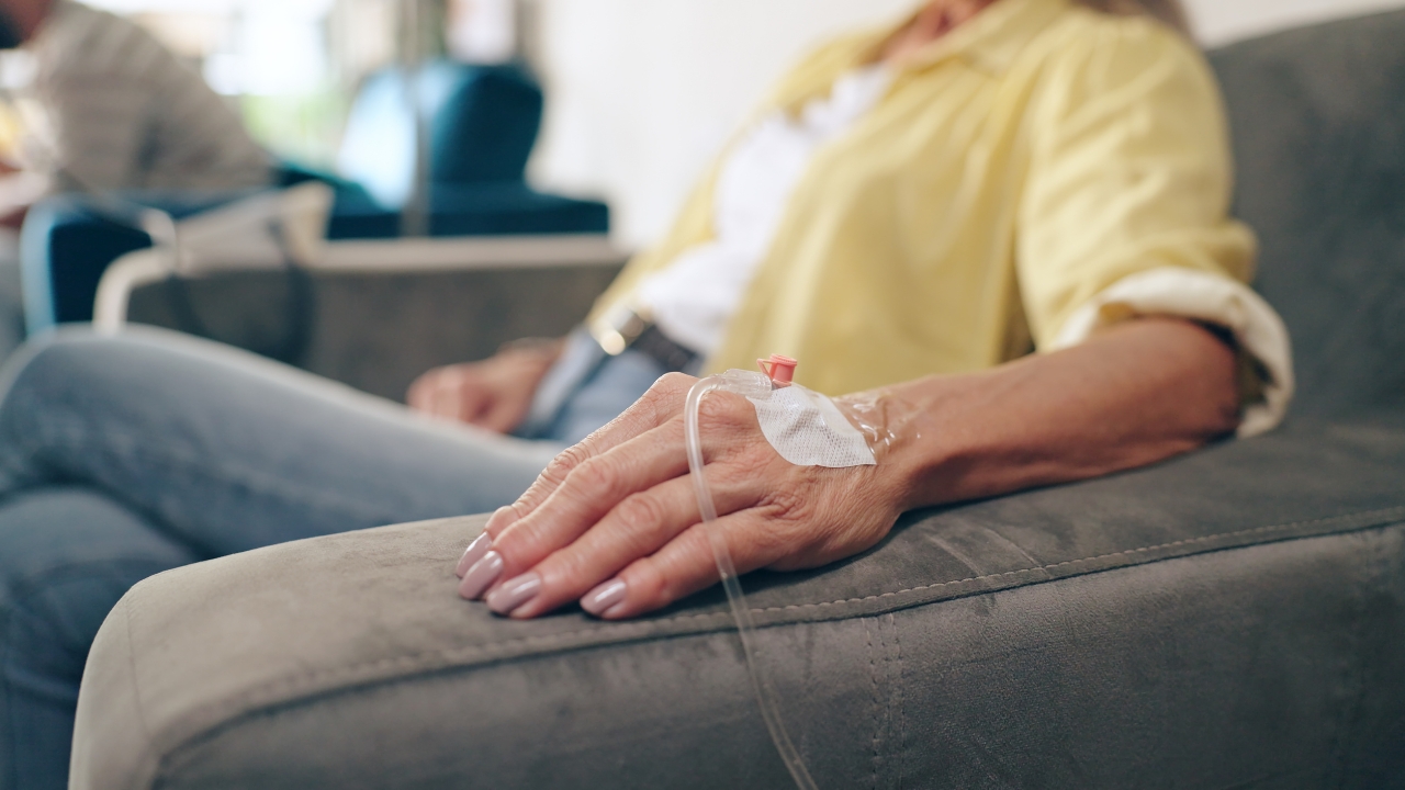 Patient receives an IV treatment during cancer radiopharmaceutical therapy care