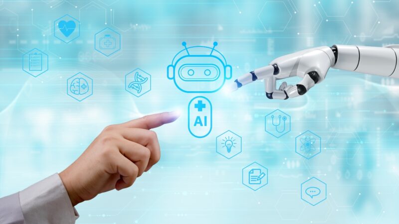 Doctor interacting with a healthcare AI interface beside a robotic hand