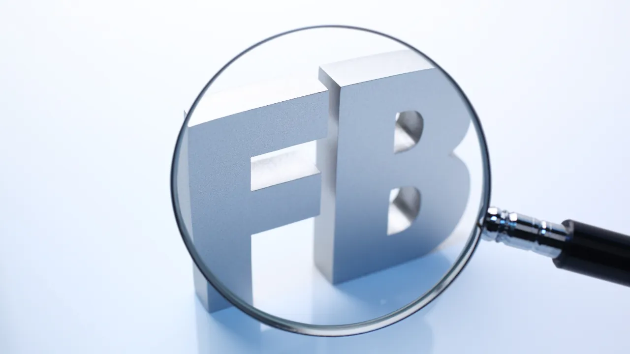 Facebook settlement second payments are shown through a magnifying glass over FB letters