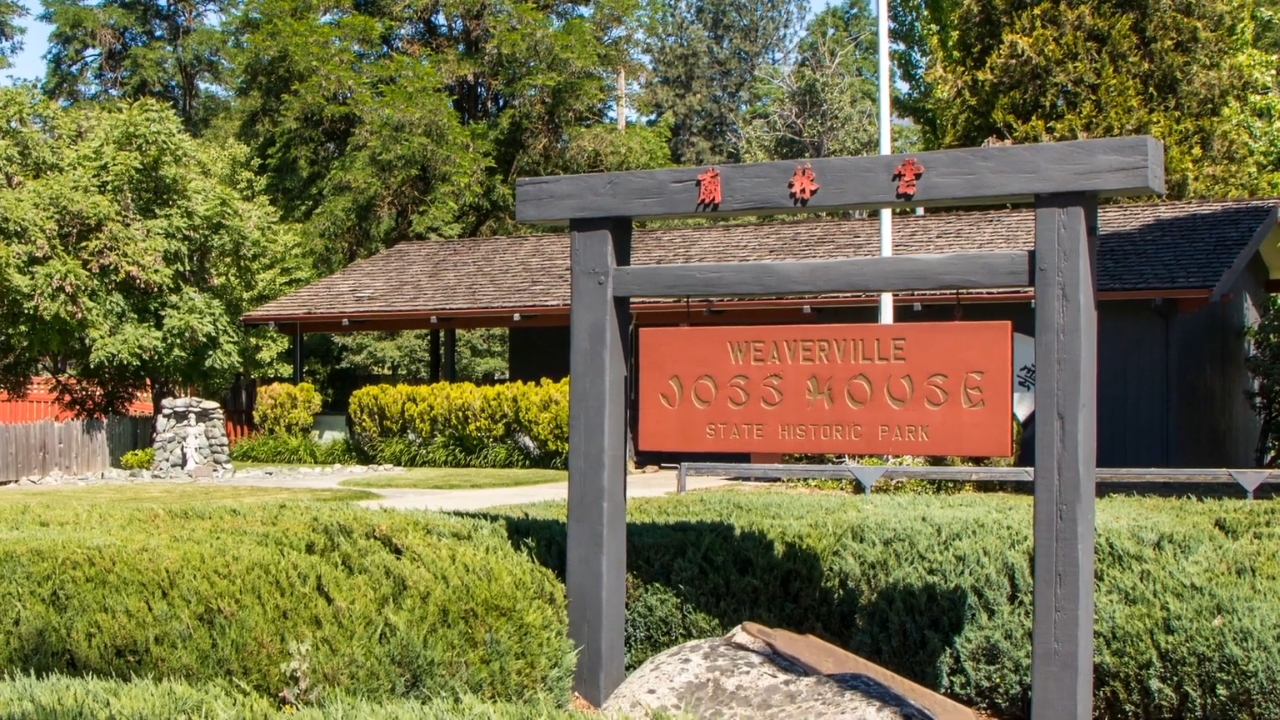 The Weaverville Joss House State Historic Park sign stands outside the historic site
