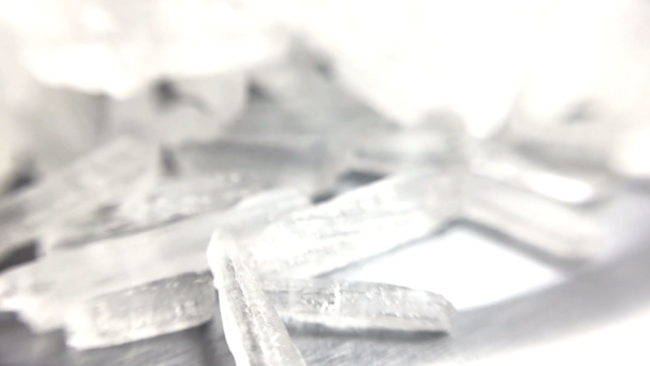 Close-up of methamphetamine crystals on a white surface