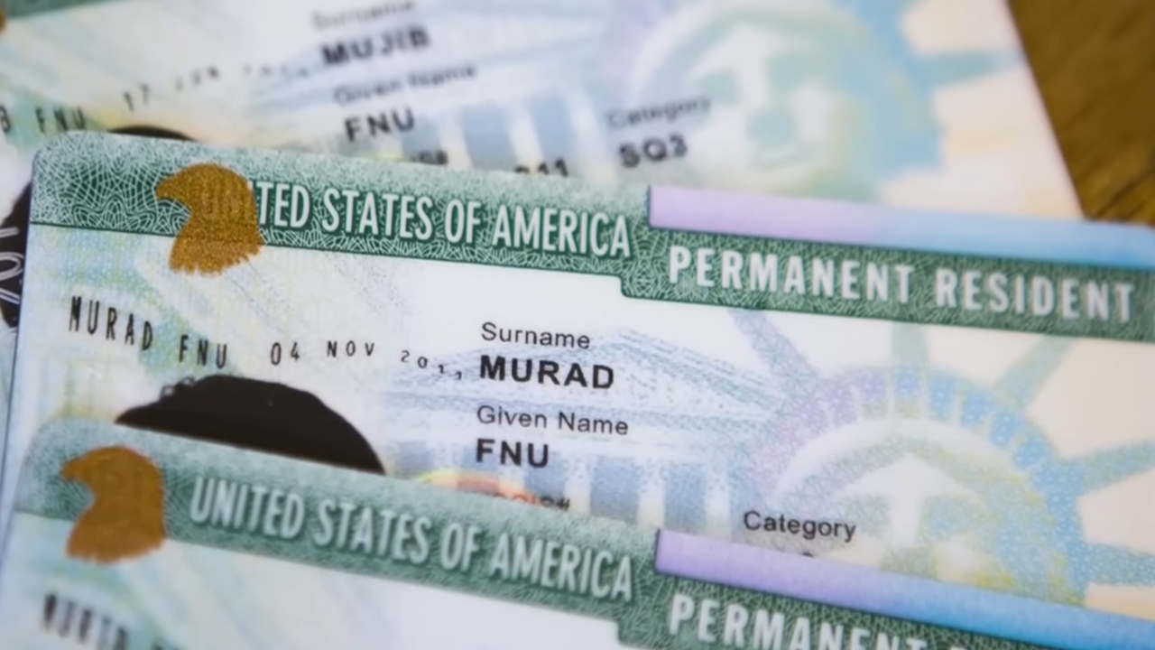 U.S. permanent resident cards arranged on a table