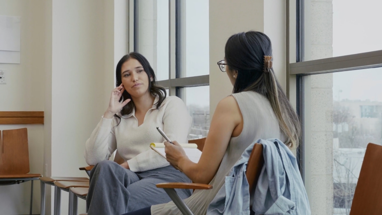 A woman talks with a counselor during a mental health appointment