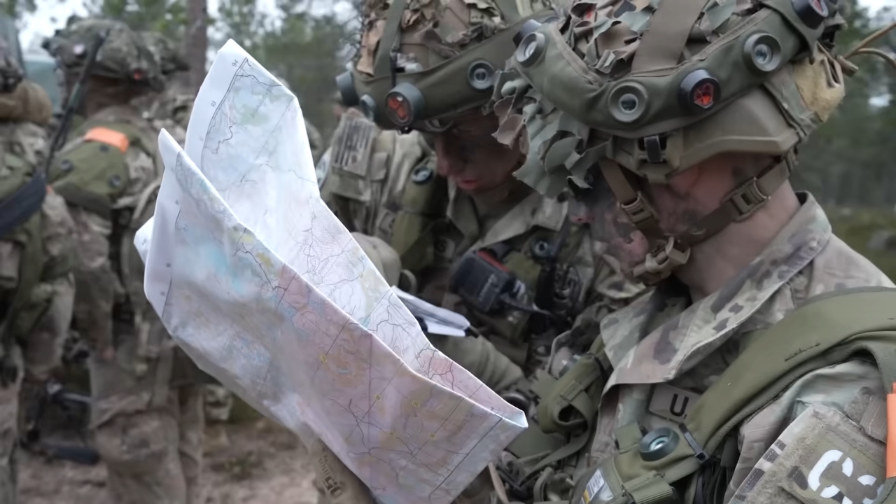 U.S. soldiers review a field map at a military exercise