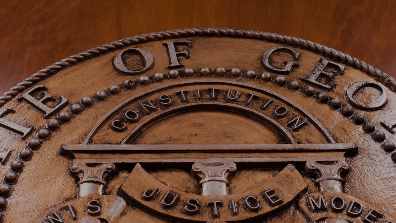 Close-up of the Georgia state seal with the words Constitution and Justice
