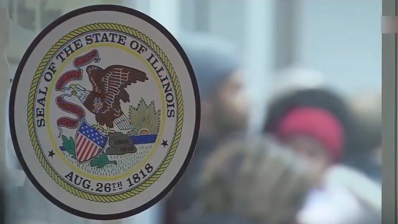 Illinois state seal appears on a glass door at a government office