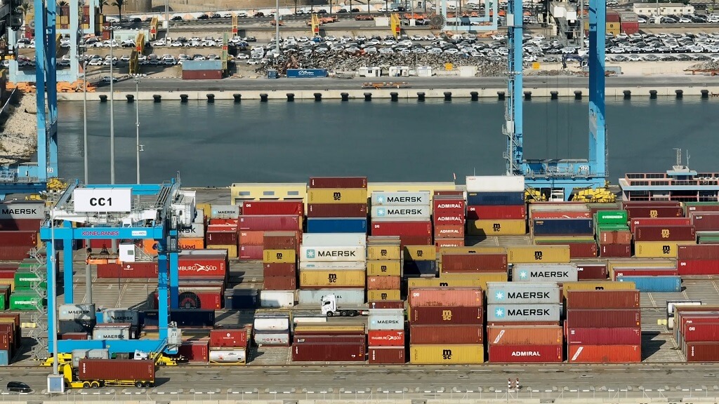 Shipping containers at a busy cargo port