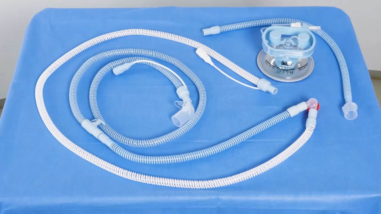 Neonatal respiratory circuit with hoses arranged on a blue hospital tray.